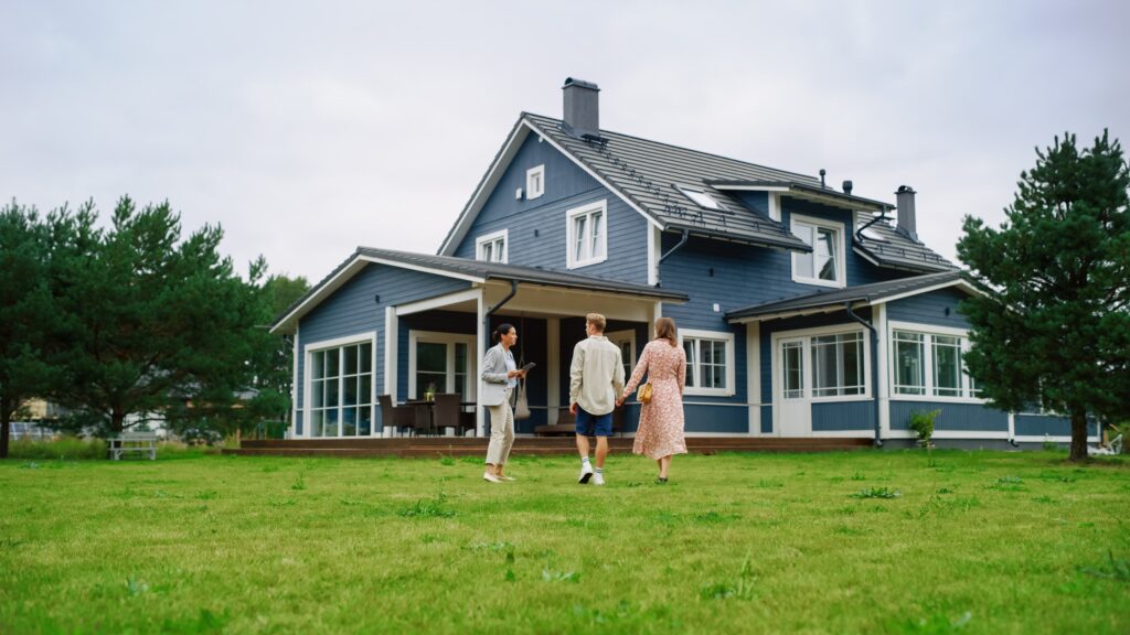 Real estate agent showing a house to a couple