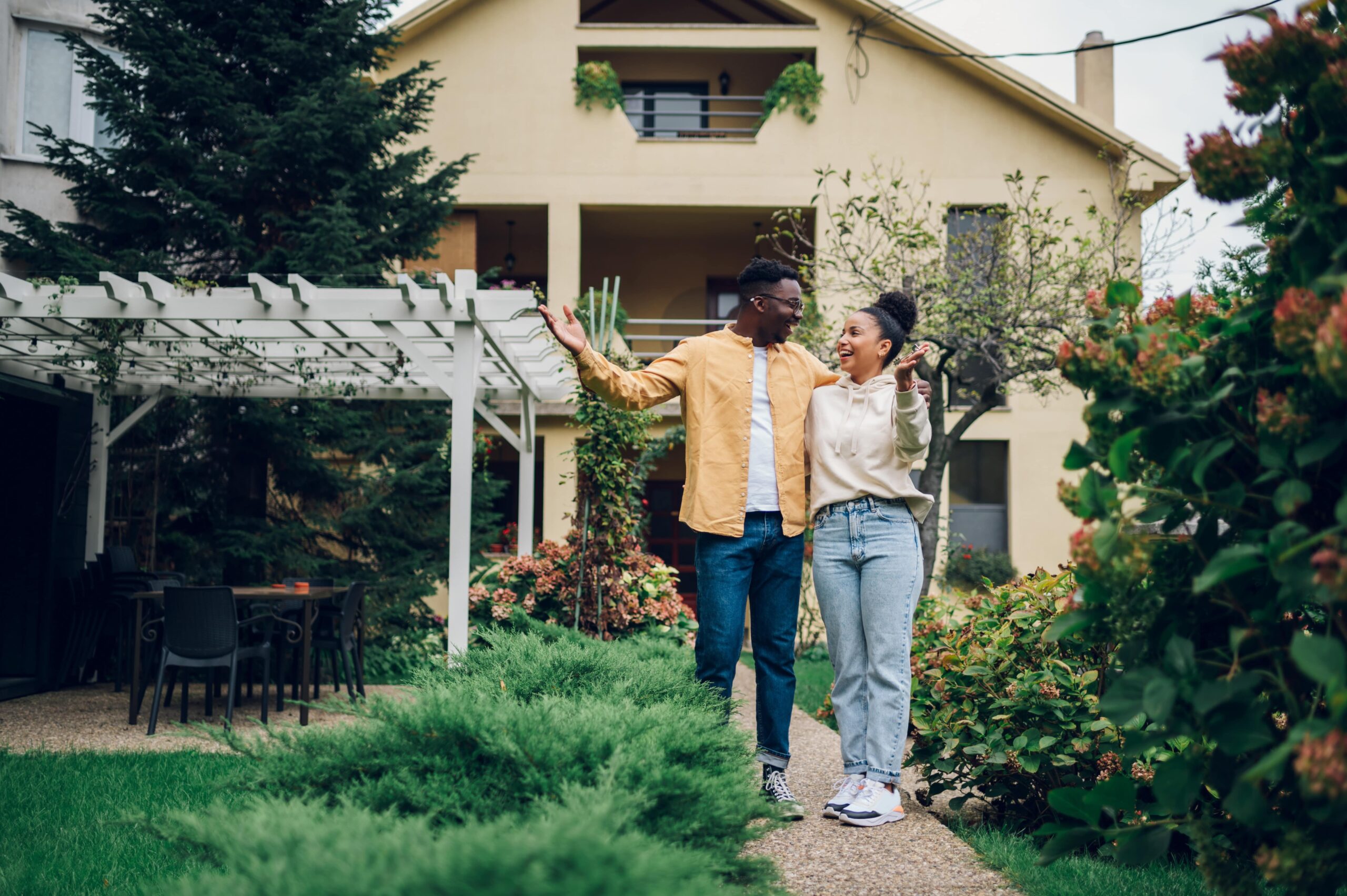 New homeowners standing on patio